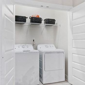 A white laundry room with a washer and dryer.at 198 Milltown Apartments, Burlington, NC 27215  